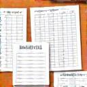 Various printable templates like meal plans, workout schedules, and habit trackers, organized neatly on a desk, ready for use.